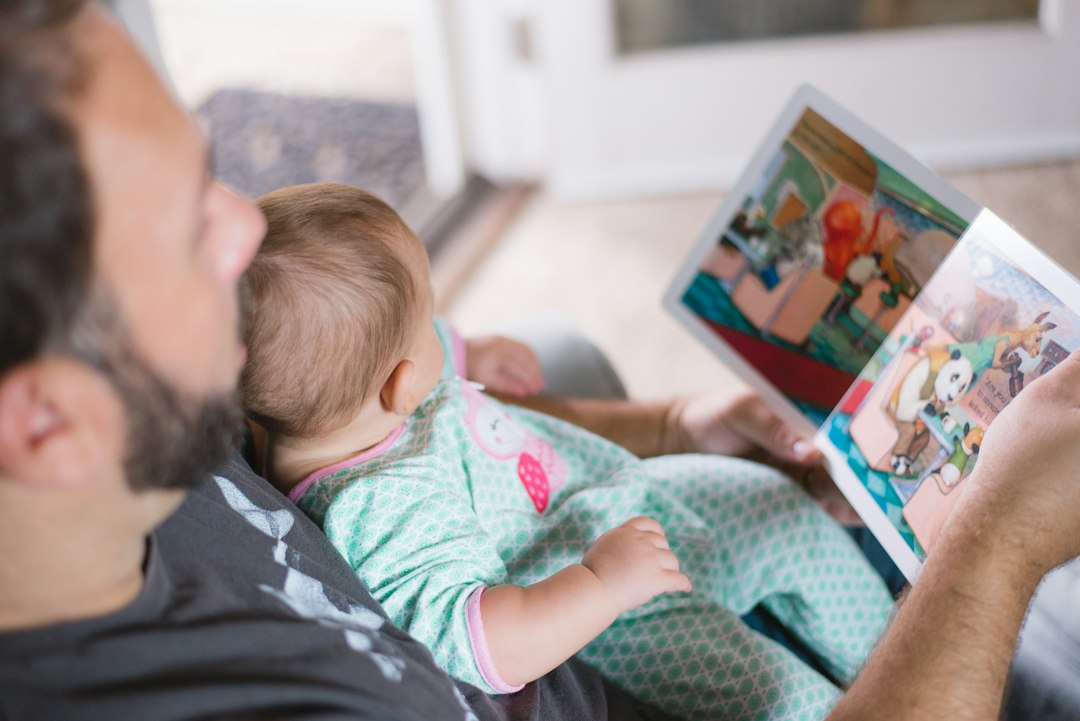 Father and child reading together as one example of family social connections